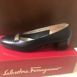 Salvatore Ferragamo Black Leather Pump with solid gold emblem buckle. Width 2A